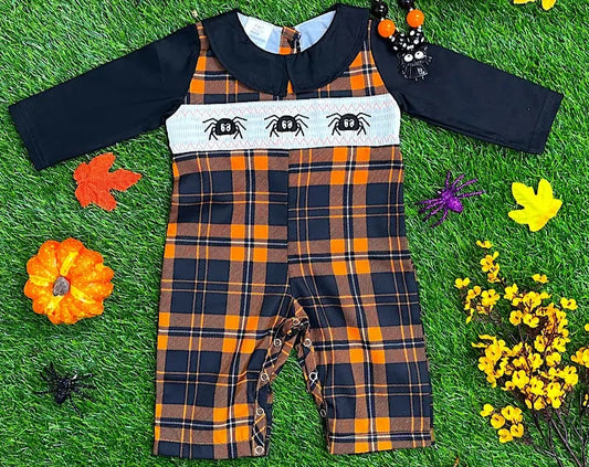 Plaid outfit with spider design on a grass background
